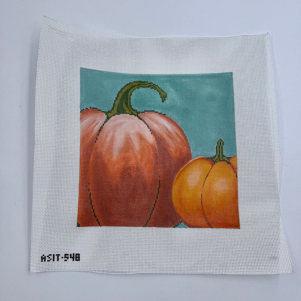 Two Pumpkins on Blue Canvas